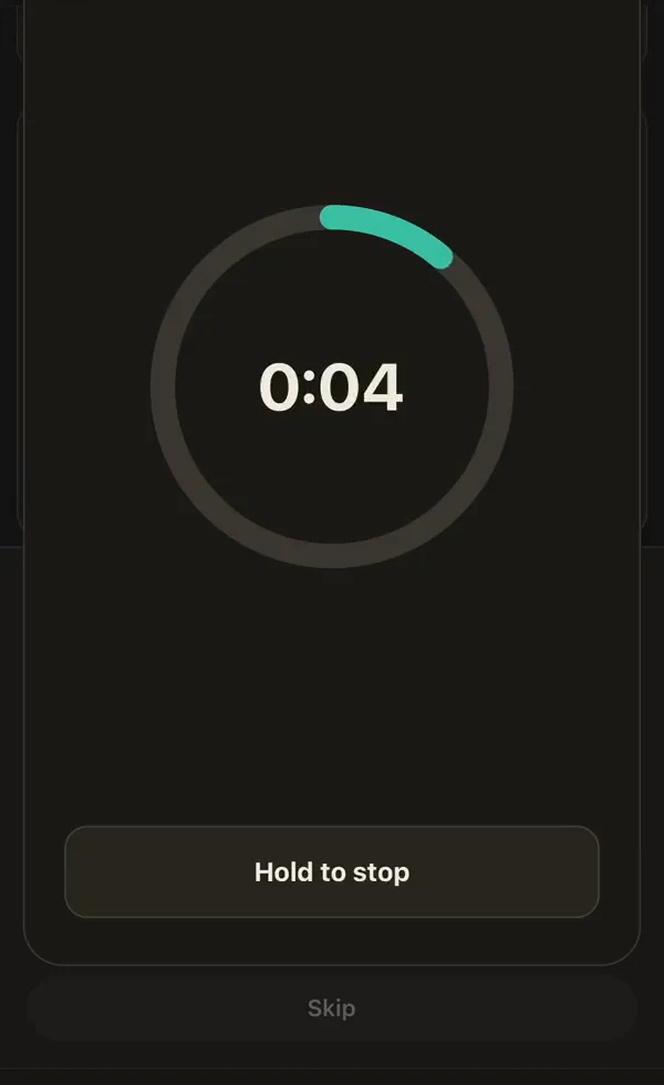 A hold timer counting down inside a teal ring, with a Hold to stop button beneath it.